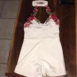 White romper with rose detail